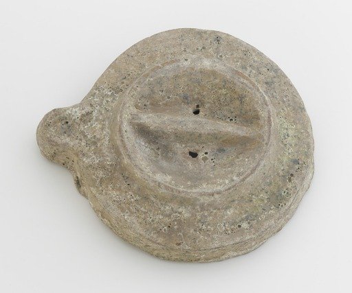 Upper grindstone from a tomb model of a mill