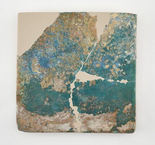 Tile, large square. Broken, repaired and restored in plaster