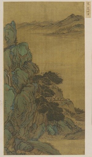 Landscape: a mountainside, a wide stream and distant hills