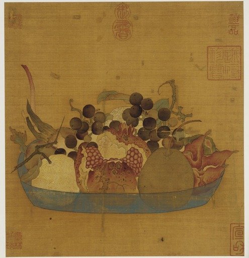 A blue glass dish filled with fruit