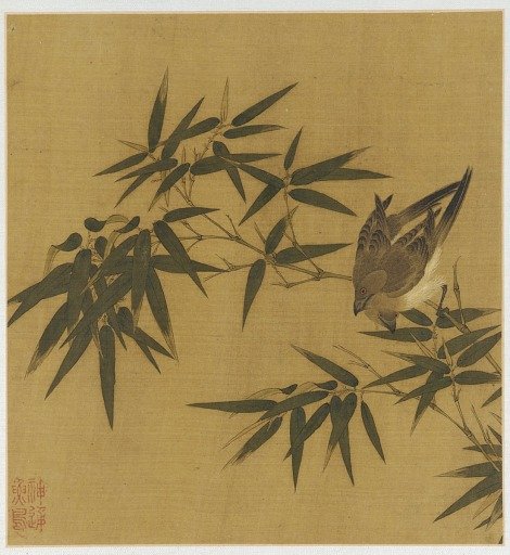 Two birds swinging on a branch of bamboo