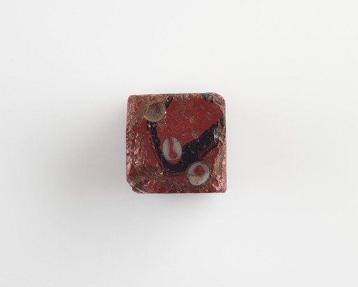 Cubic gaming die. Edges nicked and a few eyes fallen off