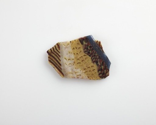 Fragment of an inlay with fish design