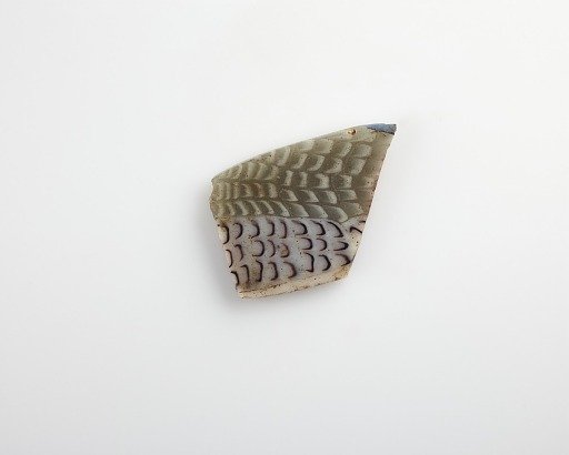 Fragment of an inlay with fish design