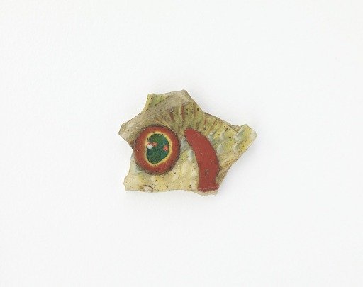 Fragment of an inlay with fish design