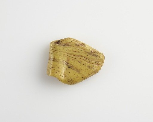 Amulet of "heart vase" (ab) form, with horizontal bore