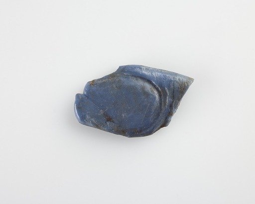 Fragment of an amulet inlay. Head missing