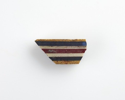 Fragment of a striped inlay
