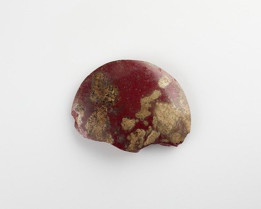 Fragment of a disk inlay; plano-convex