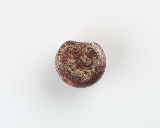 A Round marker for games. Chipped