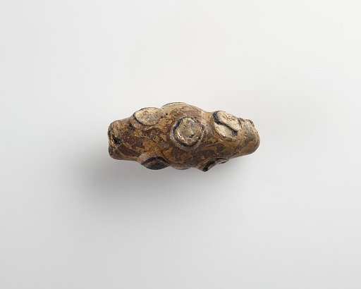 Bead, large spindle-shaped. One end broken