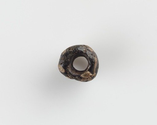 Bead, with a large bore; irregular