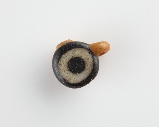 Eye-bead, with an eyelet and also a lateral bore
