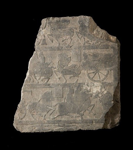 Slab in low relief from mortuary chamber; design, in three registers, of horses, riders, and carts