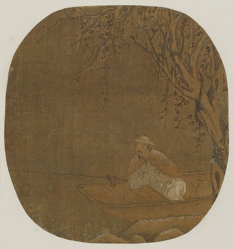 Man fishing from a boat under a tree