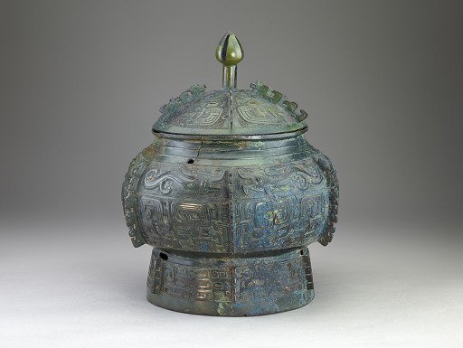 Container (<em>bu</em>) with masks (<em>taotie</em>), dragons, and waterfowl