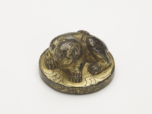 Possibly weight with a crouching tiger