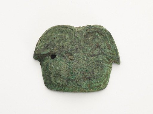Ornament in the form of an animal mask