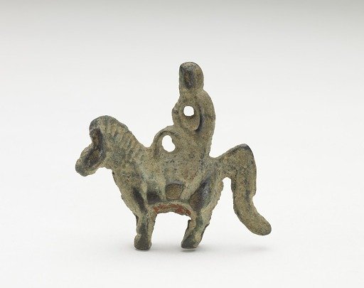Ornament in the form of possibly a monkey riding a horse