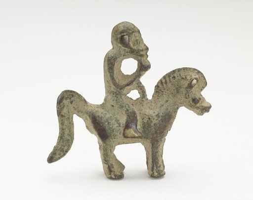 Orament in the form of a monkey riding a horse