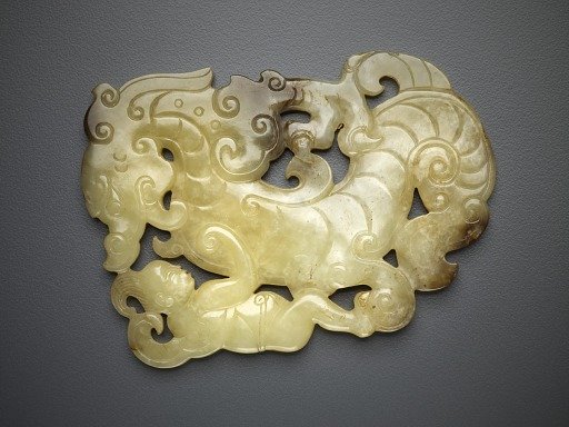 Plaque in the form of a dragon