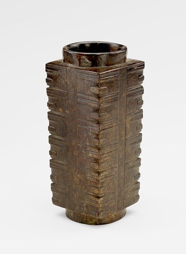 Six-tier tube (<em>cong</em> 琮) with masks, probably recut