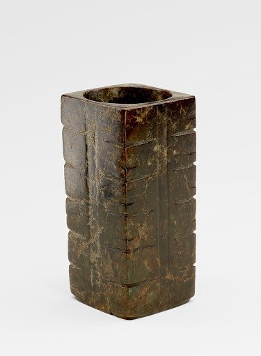 Six-tier tube (<em>cong</em> 琮) with masks, probably recut