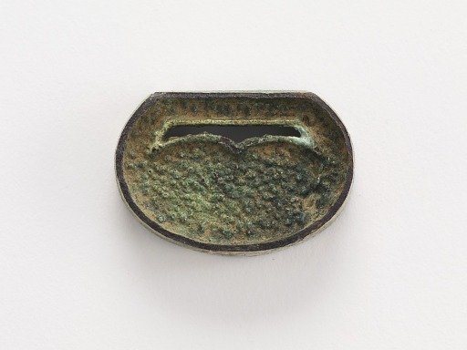 Belt ornament (part of a group of ten: F1916.428-429, 726-730, 740, 743-744)