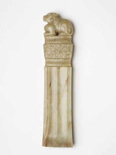 Ornament in the form of a chisel