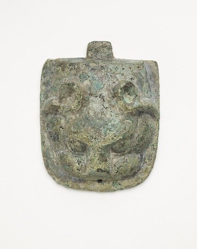 Ornament in the form of an animal mask