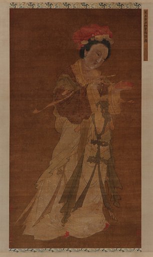 Writing a poem on a crimson leaf