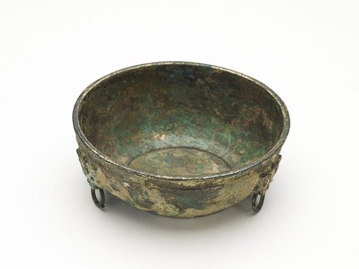 Bowl with masks and ring handles