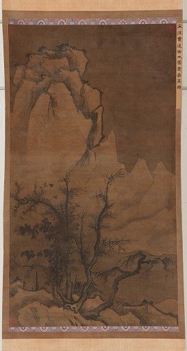 Winter trees and snowy peaks