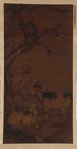 Three goats under a flowering plum tree