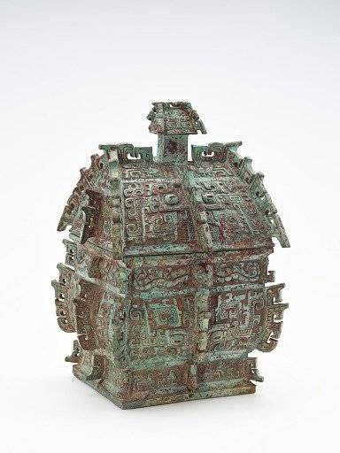 Ritual wine container (<em>fangyi</em>) with masks(<em>taotie</em>), serpents, and birds