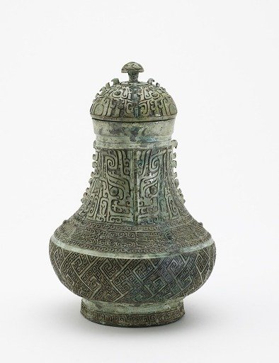 Lidded ritual wine container (<em>hu</em>) with masks and dragons