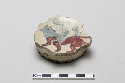 Fragment with a winged quadruped