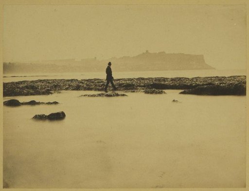 Strollers in South Bay, Scarborough, at Low Tide, with the Silhouette of the Town (Headland) in the Background