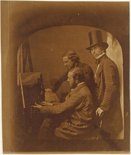 Three men with a painting on an easel