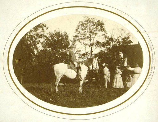 General Robert E. Lee on his Horse "Traveller", with Other Figures in the Background