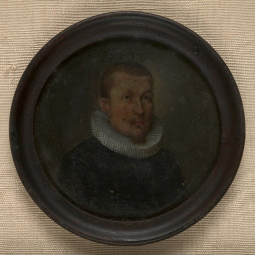 Portrait miniature of a bareheaded, pointed-bearded man facing right, in a round frame