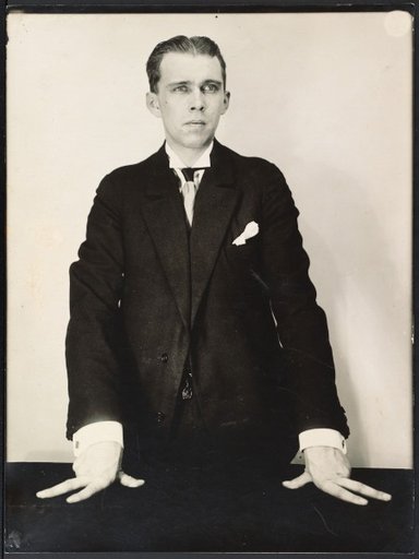 Man with hands resting