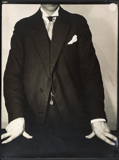 Man with hands resting
