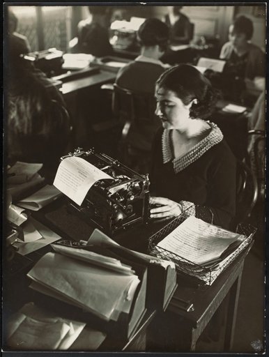 Women at typewriters in an open-plan office