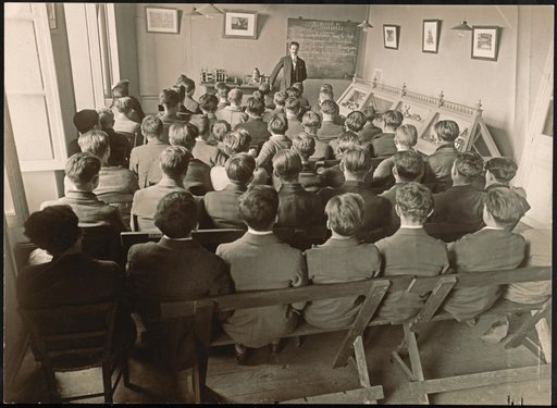 Classroom with Teacher in Front of Boys' Class