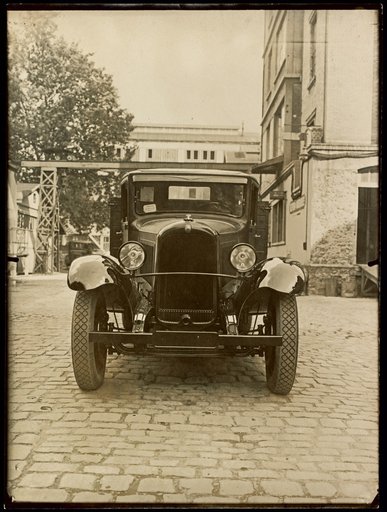 Citroën Automobile with Commercial Building in Background