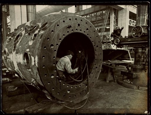 Worker Inside a Large Metal Workpiece