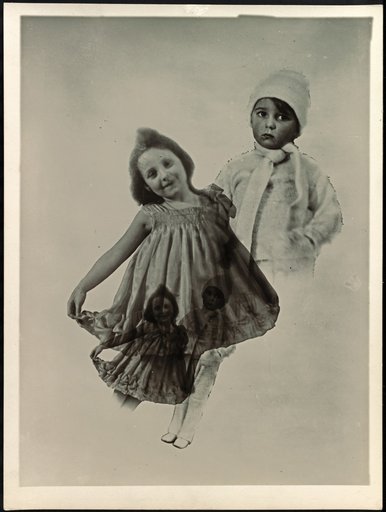 Little girl in a summer dress and boy in winter clothing