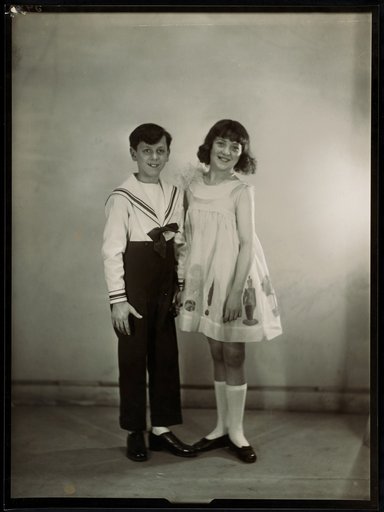Boy in sailor suit, girl in summer dress