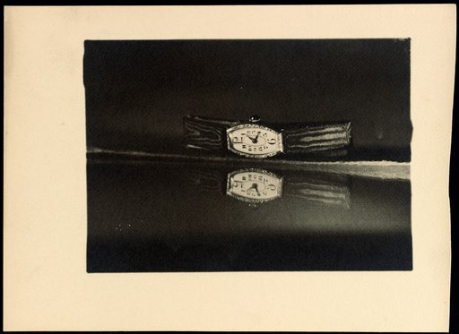 Wristwatch reflected in a mirror